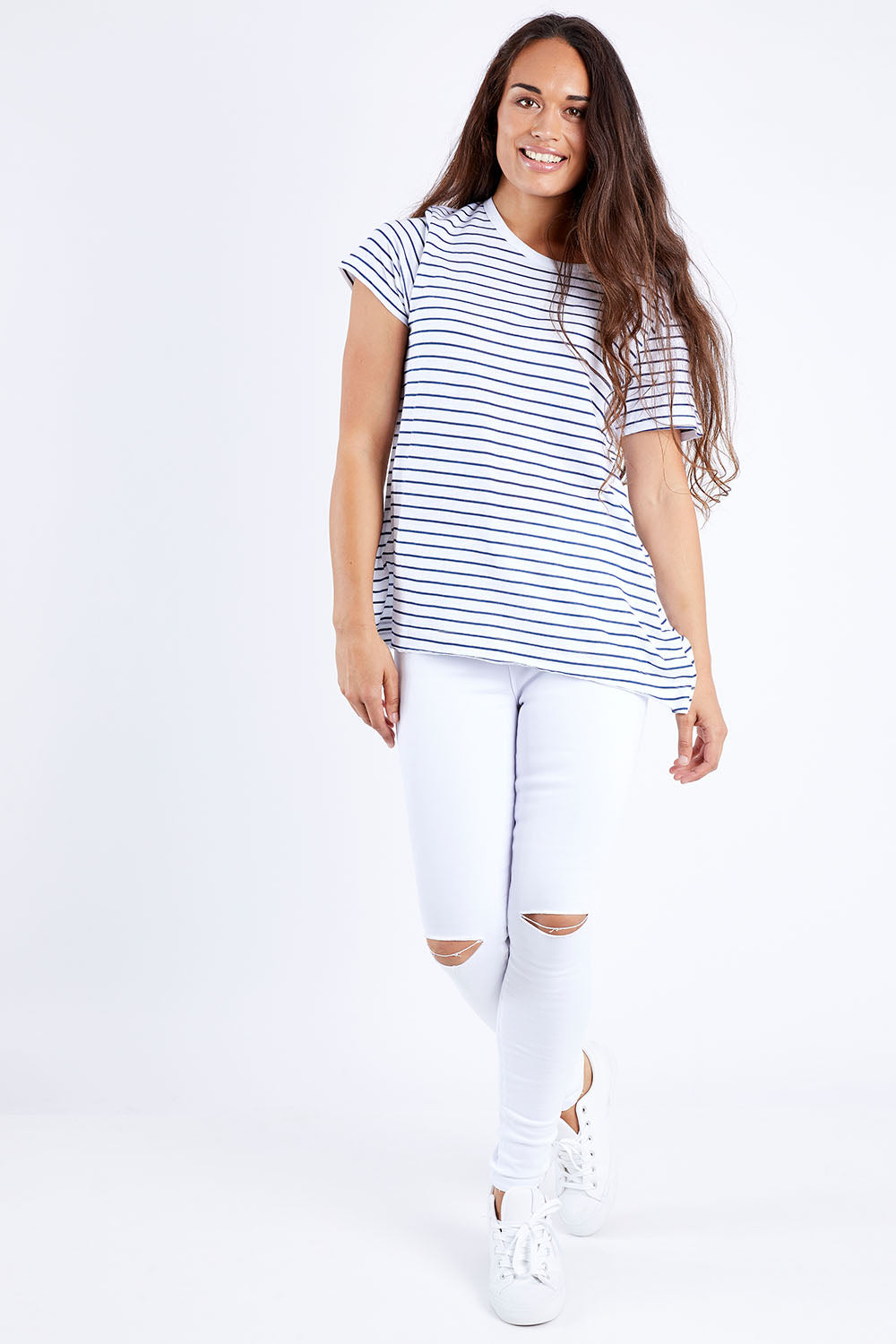 Model Larissa wearing size 10 of the Lucy Ripped Knee High Rise Jean in colour White (White), from the front, showing the whole outfit