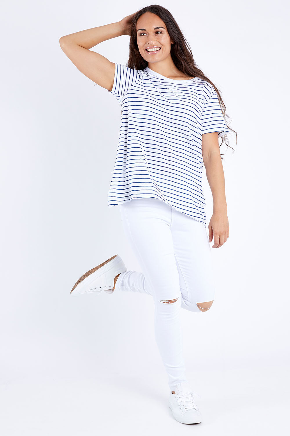 Model Larissa wearing size 10 of the Lucy Ripped Knee High Rise Jean in colour White (White), from the front, showing the whole outfit