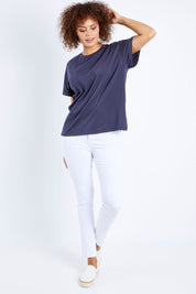 Model Lala wearing size 10 of the Zoey High Rise Skinny Jean in colour White (White), from the front, showing the whole outfit
