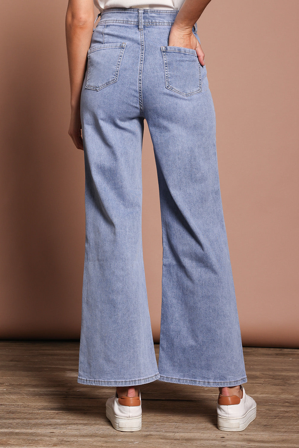 Model Madeline wearing size 9 of the Candice Wide Leg Jean in colour Lightblue (Blue), from the back