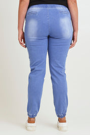 Model Chanel wearing size 16 of the Harlow Cargo Jogger in colour Middenim (Blue), from the back