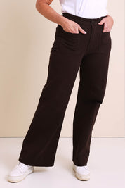 Model Sandys wearing size 10 of the Katie High-waisted Front Pocket Wide Leg Jean - Chocolate in colour Chocolate, in a cropped view