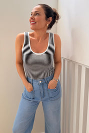A model wearing size 10 of the Katie Highin colourWaisted Front Pocket Wide Leg Jean - Fadedenim (Blue), from the front, showing the whole outfit