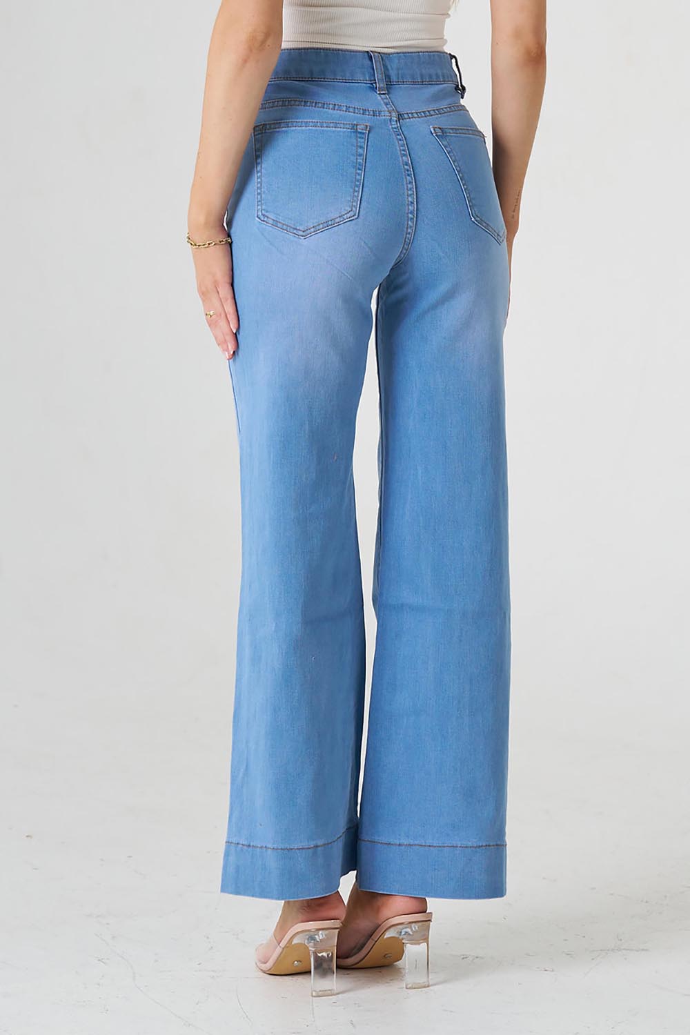 A model wearing the Katie Highin colourWaisted Front Pocket Wide Leg Jean - Fadedenim (Blue), from the back