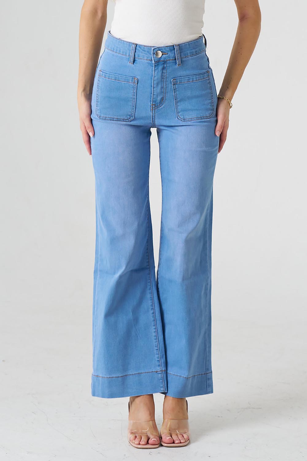 A model wearing the Katie Highin colourWaisted Front Pocket Wide Leg Jean - Fadedenim (Blue), from the front, cropped image