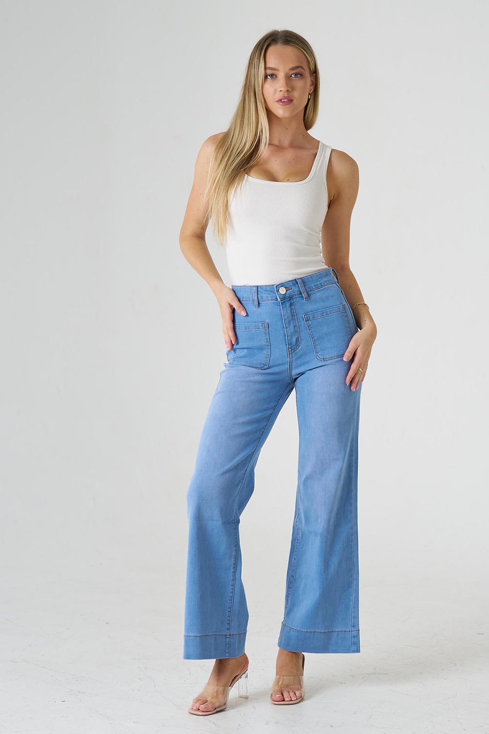 A model wearing the Katie Highin colourWaisted Front Pocket Wide Leg Jean - Fadedenim (Blue), from the front, showing the whole outfit