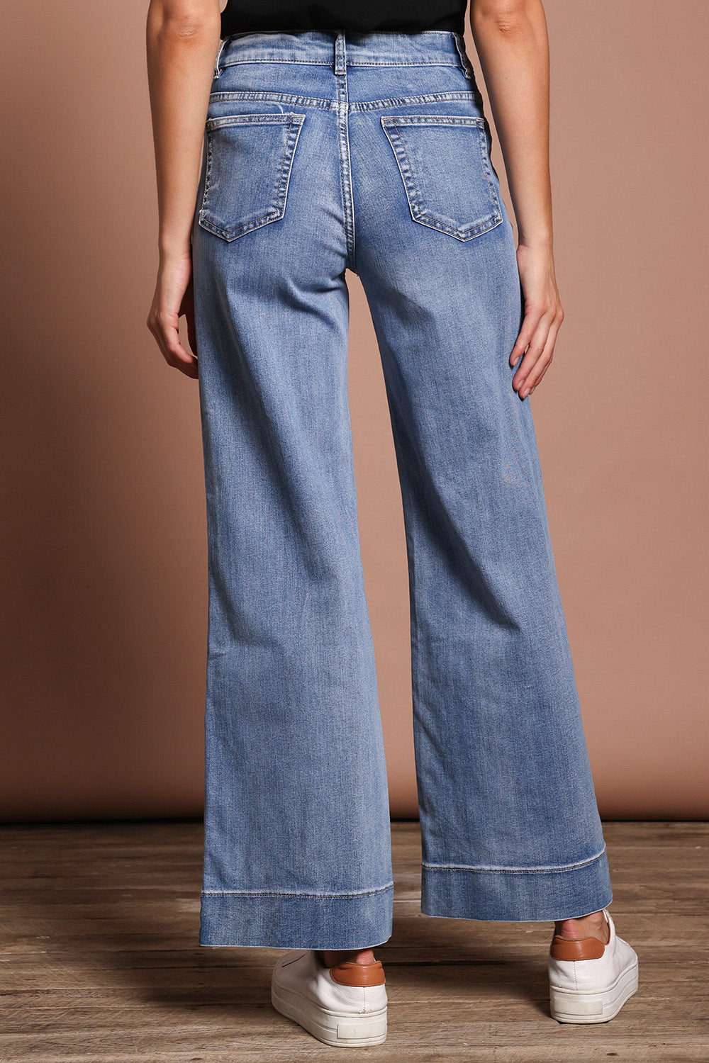 Model Madeline wearing size 9 of the Katie Highin colourWaisted Front Pocket Wide Leg Jean - Lightdenim (Blue), from the back