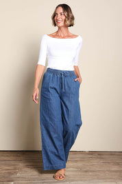 Model Riinar wearing size 10 of the Maya Wide Leg Drawstring Jean - Middenim in colour Middenim, from the front