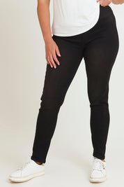 Model Chanel wearing size 16 of the Paige Pull On Jean in colour Black (Black), from the front, cropped image