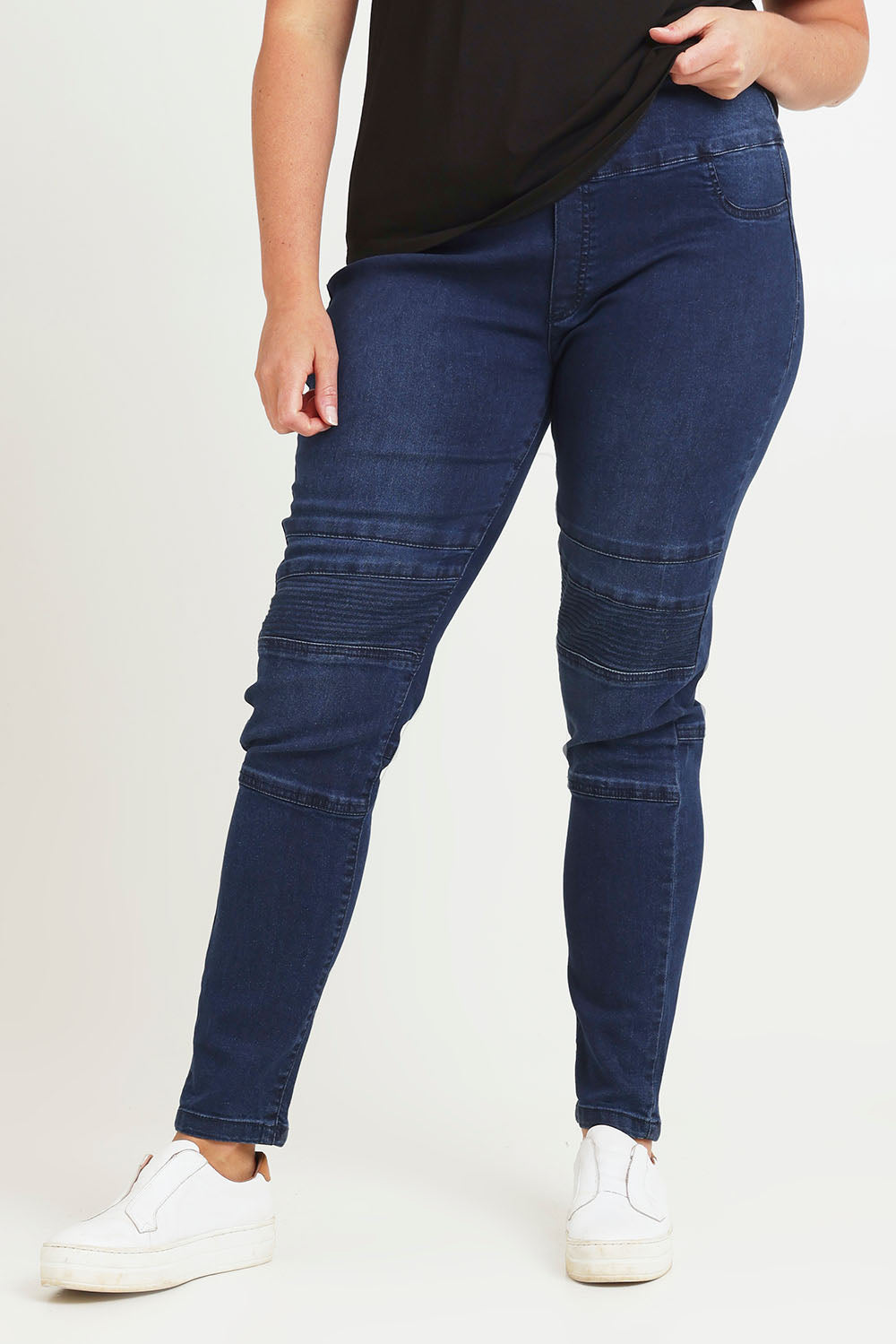 Model Chanel wearing size 16 of the River Ribbed Pull On Jean in colour Darkdenim (Blue), from the front, cropped image