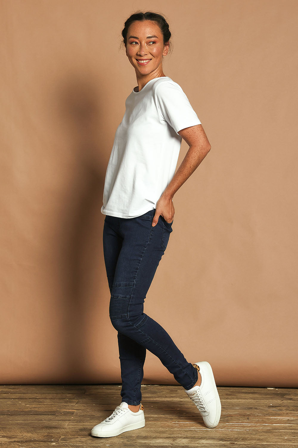 Model Katie wearing size 10 of the River Ribbed Pull On Jean in colour Darkdenim (Blue), from the front, showing the whole outfit