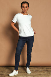 Model Noli wearing size 10 of the River Ribbed Pull On Jean in colour Darkdenim (Blue), from the front, showing the whole outfit
