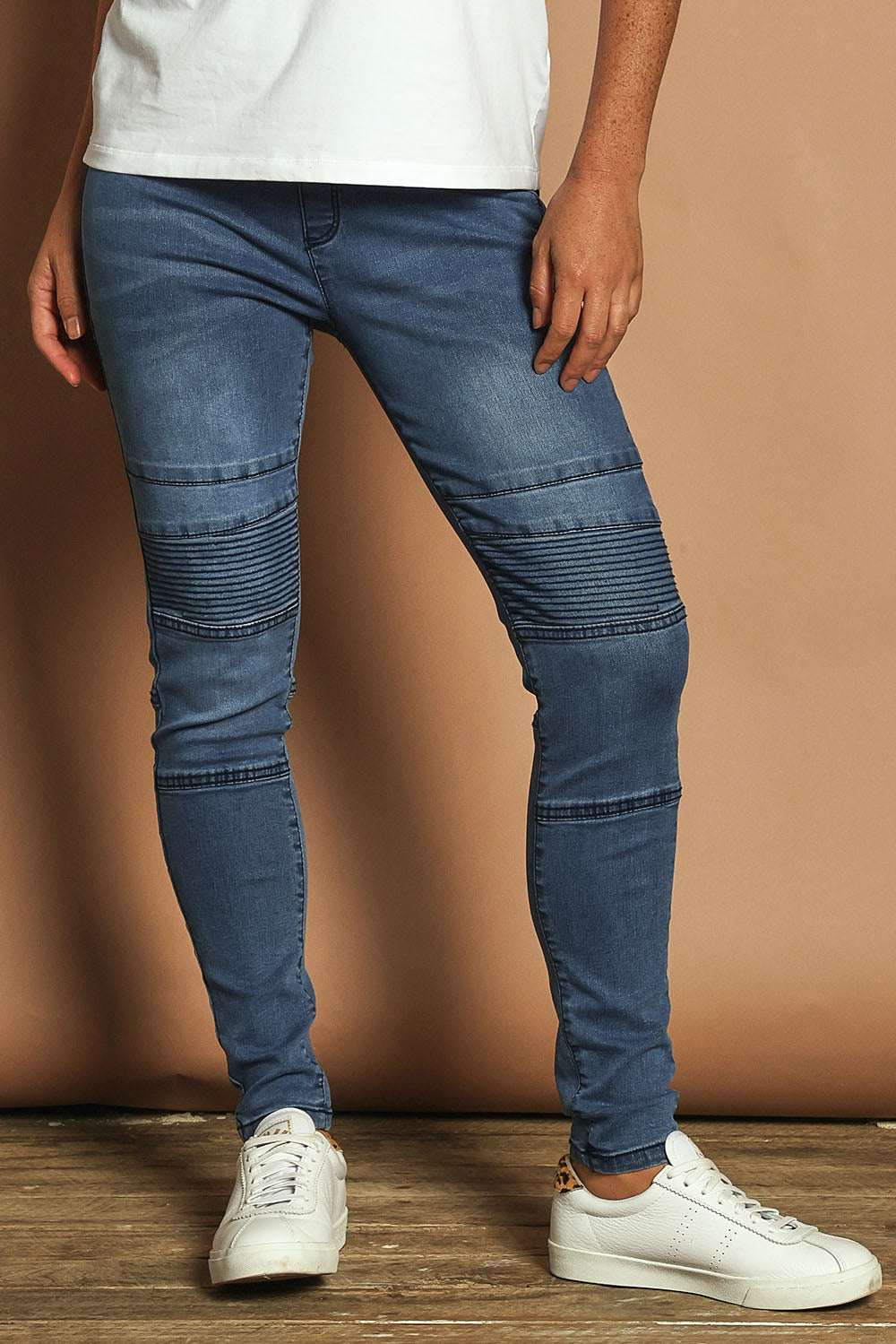 Model Katie wearing size 10 of the River Ribbed Pull On Jean in colour Midblue (Blue), from the front, cropped image