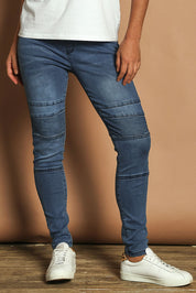 Model Katie wearing size 10 of the River Ribbed Pull On Jean in colour Midblue (Blue), from the front, cropped image