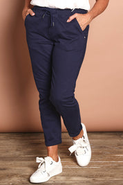 Model Sandy wearing size 10 of the Robin Drawstring Pull On Pant in colour Navy (Blue), from the front, cropped image