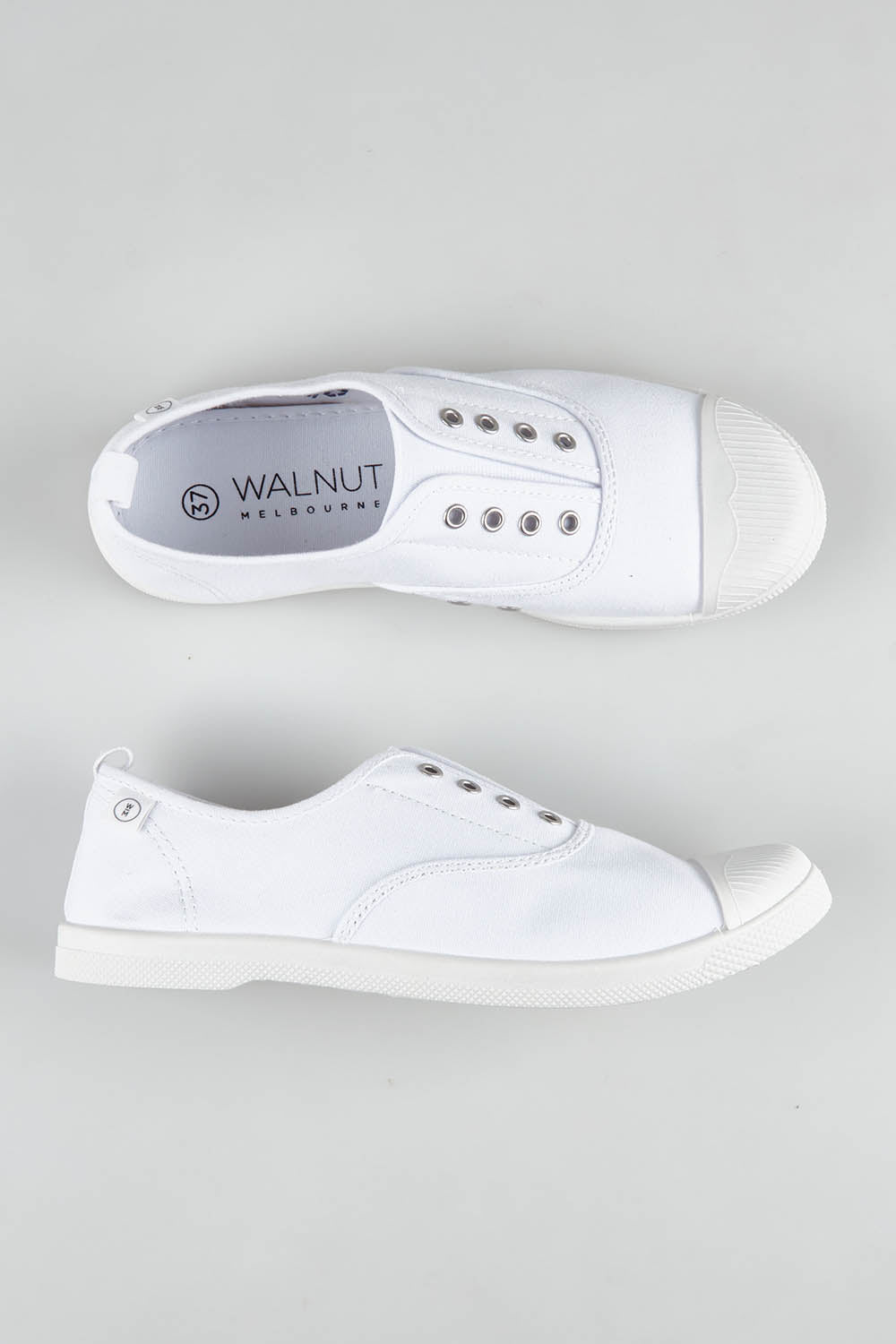 A model wearing size 37 of the Euro Elastic Plimsole in colour White (White), from the front, showing the whole outfit