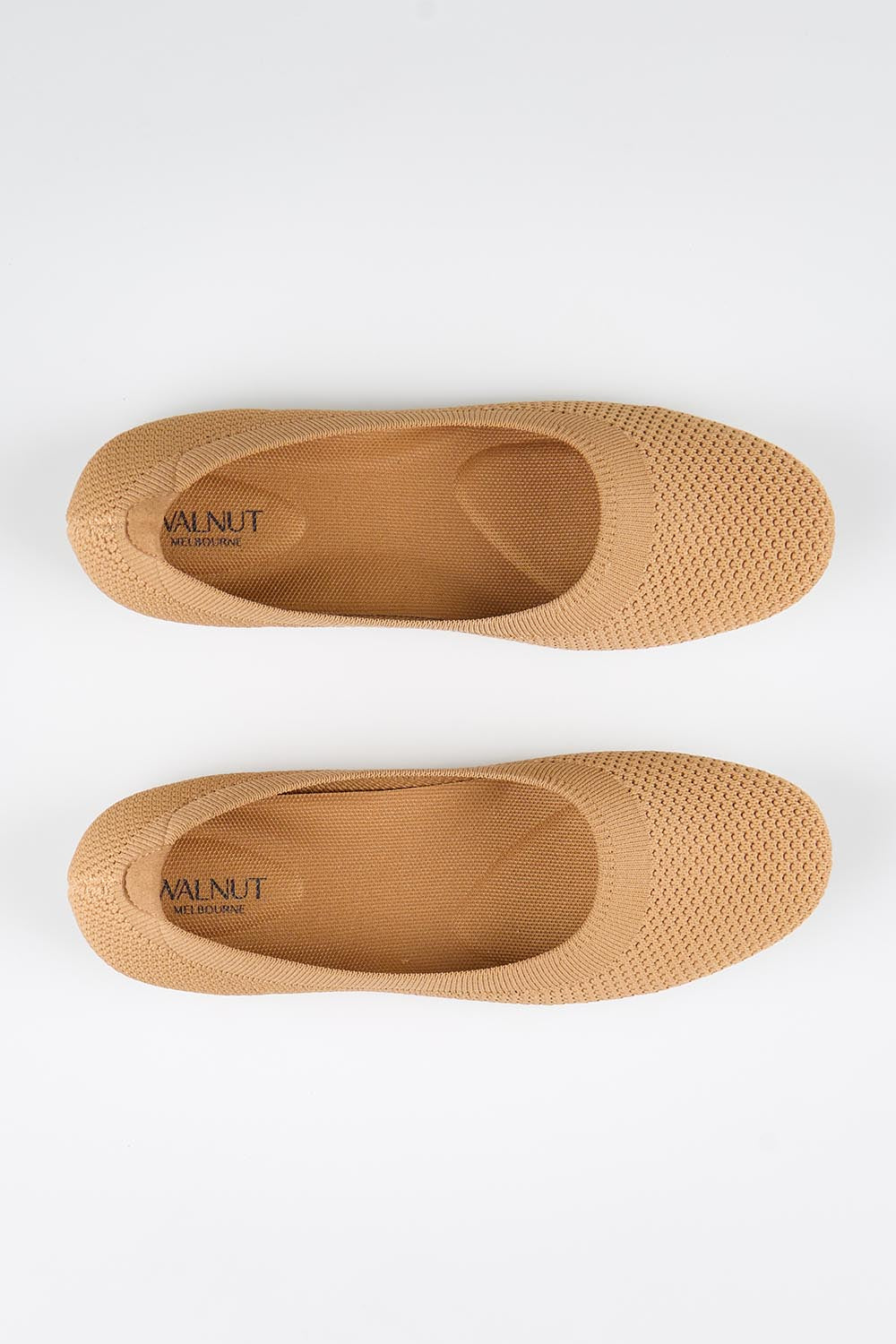 Model Genericm wearing size sample of the Eva Knit Ballet Flat - Tan in colour Tan, in a cropped view