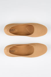 Model Genericm wearing size sample of the Eva Knit Ballet Flat - Tan in colour Tan, in a cropped view