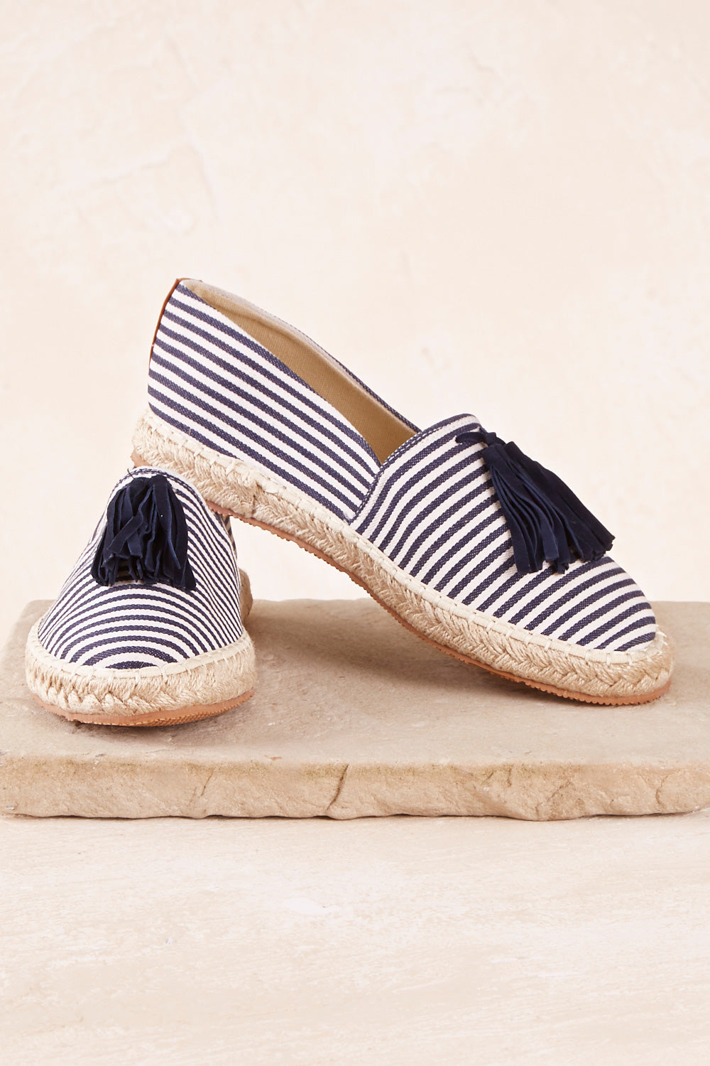 A model wearing size 37 of the Georgie Tassel Espadrille in colour NavyStrip (Blue), from the front, showing the whole outfit