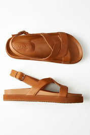 A model wearing size 37 of the Murphy Leather Sandal in colour Coconut, from the front, showing the whole outfit