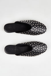 A model wearing size 37 of the Soho Studded Mule in colour Black (Black), from the front, showing the whole outfit