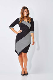 Model Laura wearing size 12 of The Contrast Striped Ponte Dress in colour BlackWhite (Black), from the front, showing the whole outfit