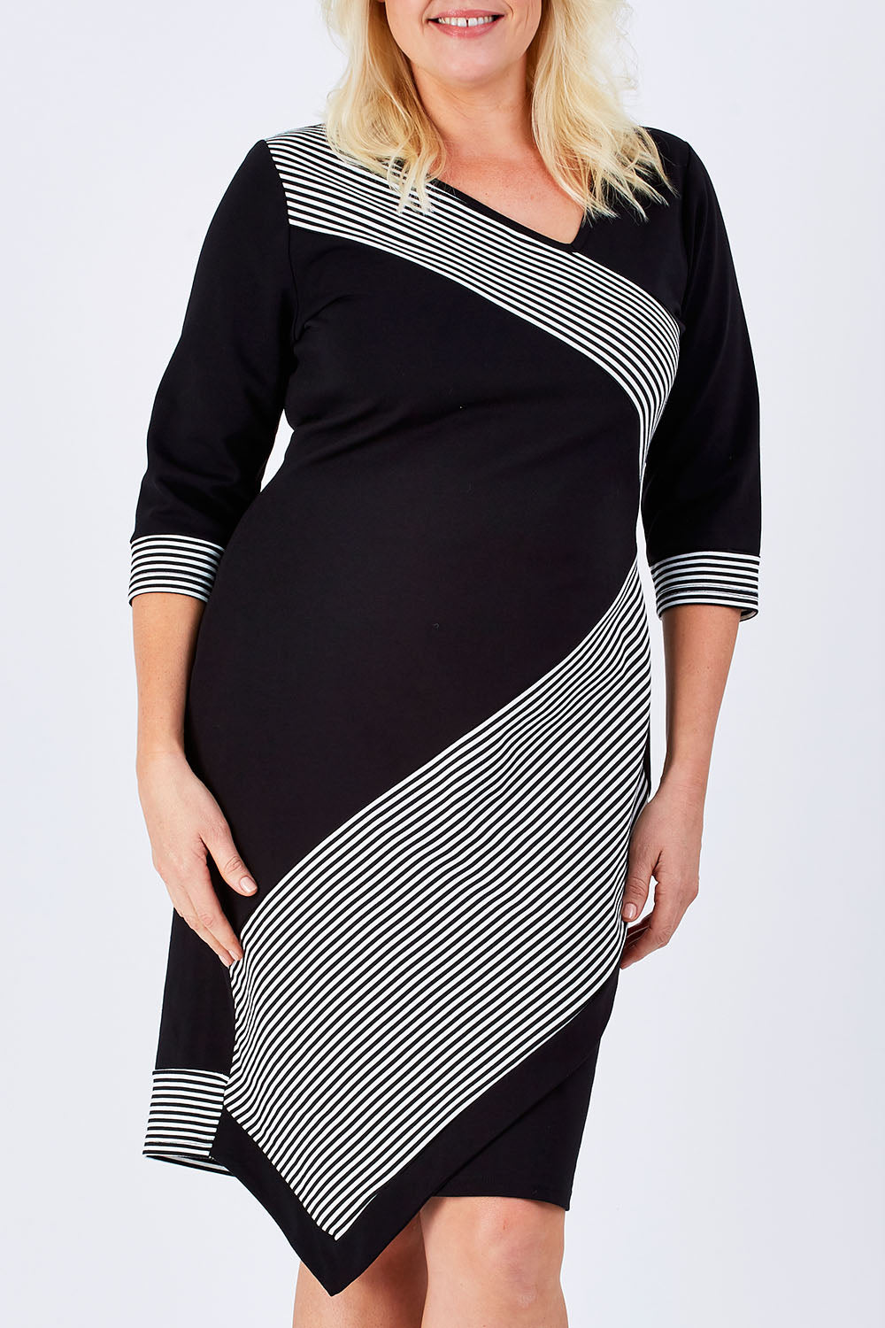 Model Natalie wearing size 16 of The Contrast Striped Ponte Dress in colour BlackWhite (Black), from the front, cropped image