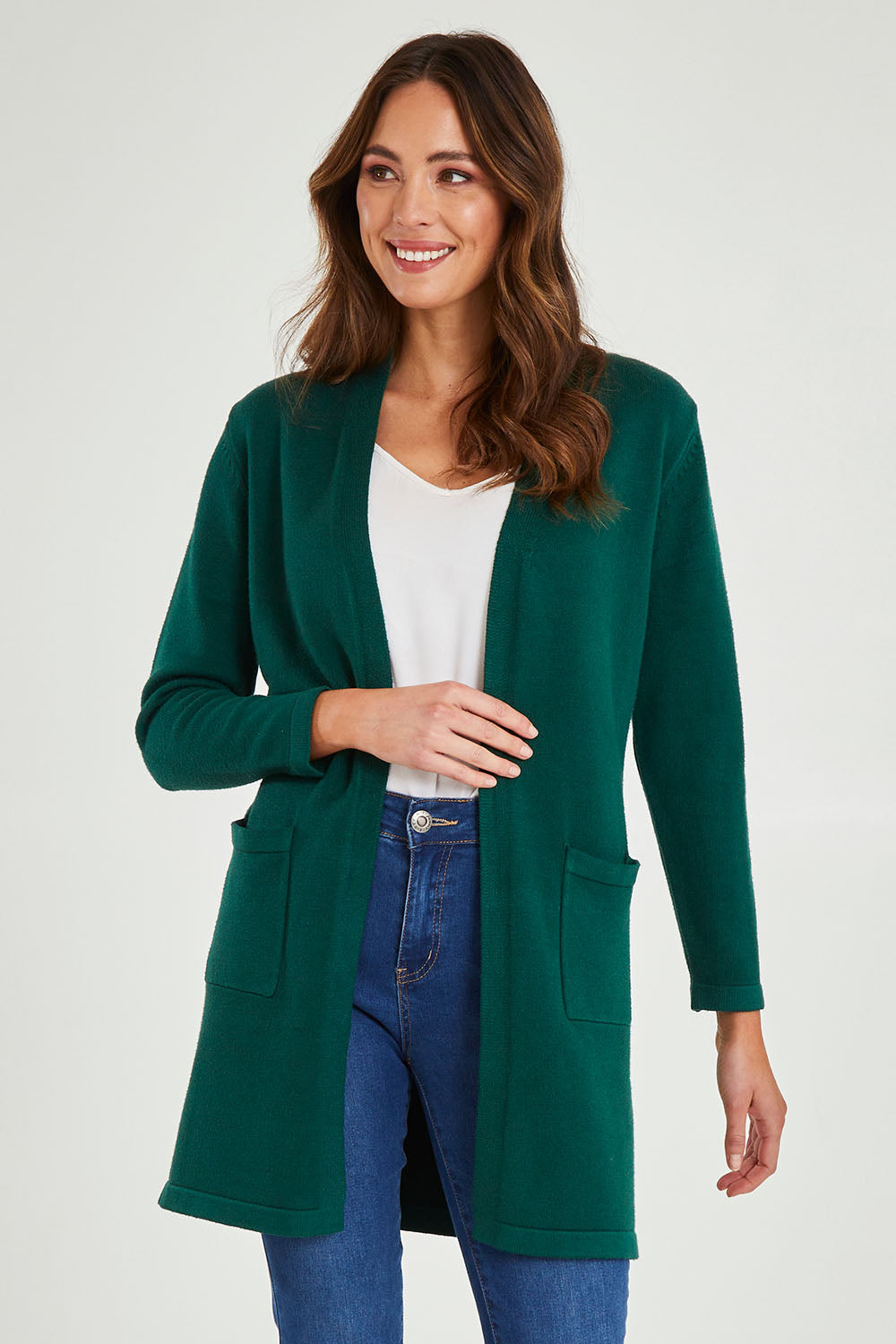 Model Madeline wearing size S of the Long Sleeve Open Cardi in colour Forest (Green), from the front, cropped image