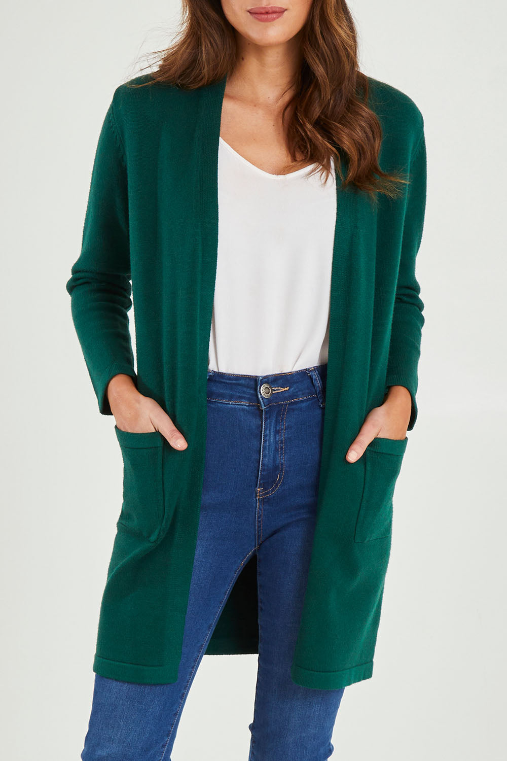 Model Madeline wearing size S of the Long Sleeve Open Cardi in colour Forest (Green), from the front, cropped image