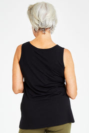 Model Elise wearing size S of the Drape Bamboo Cami in colour Black (Black), from the back