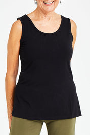 Model Elise wearing size S of the Drape Bamboo Cami in colour Black (Black), from the front, cropped image