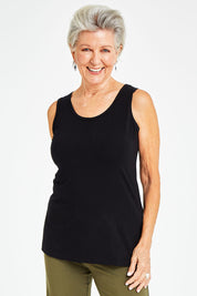 Model Elise wearing size S of the Drape Bamboo Cami in colour Black (Black), from the front, cropped image