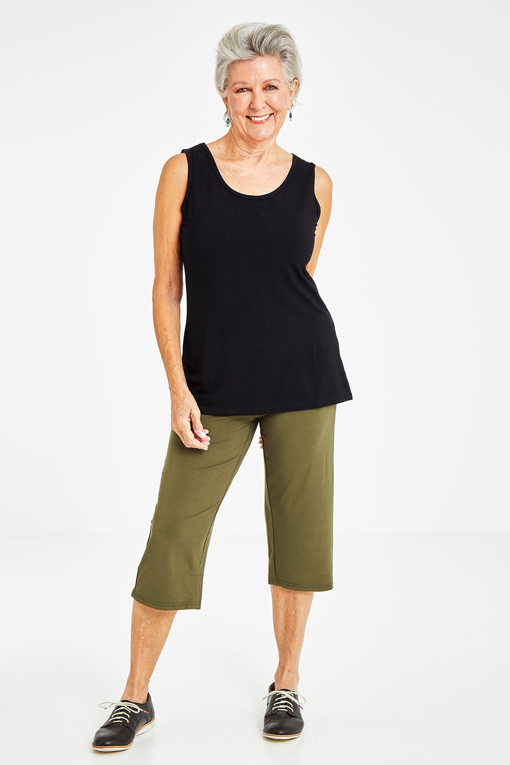 Model Elise wearing size S of the Drape Bamboo Cami in colour Black (Black), from the front, showing the whole outfit