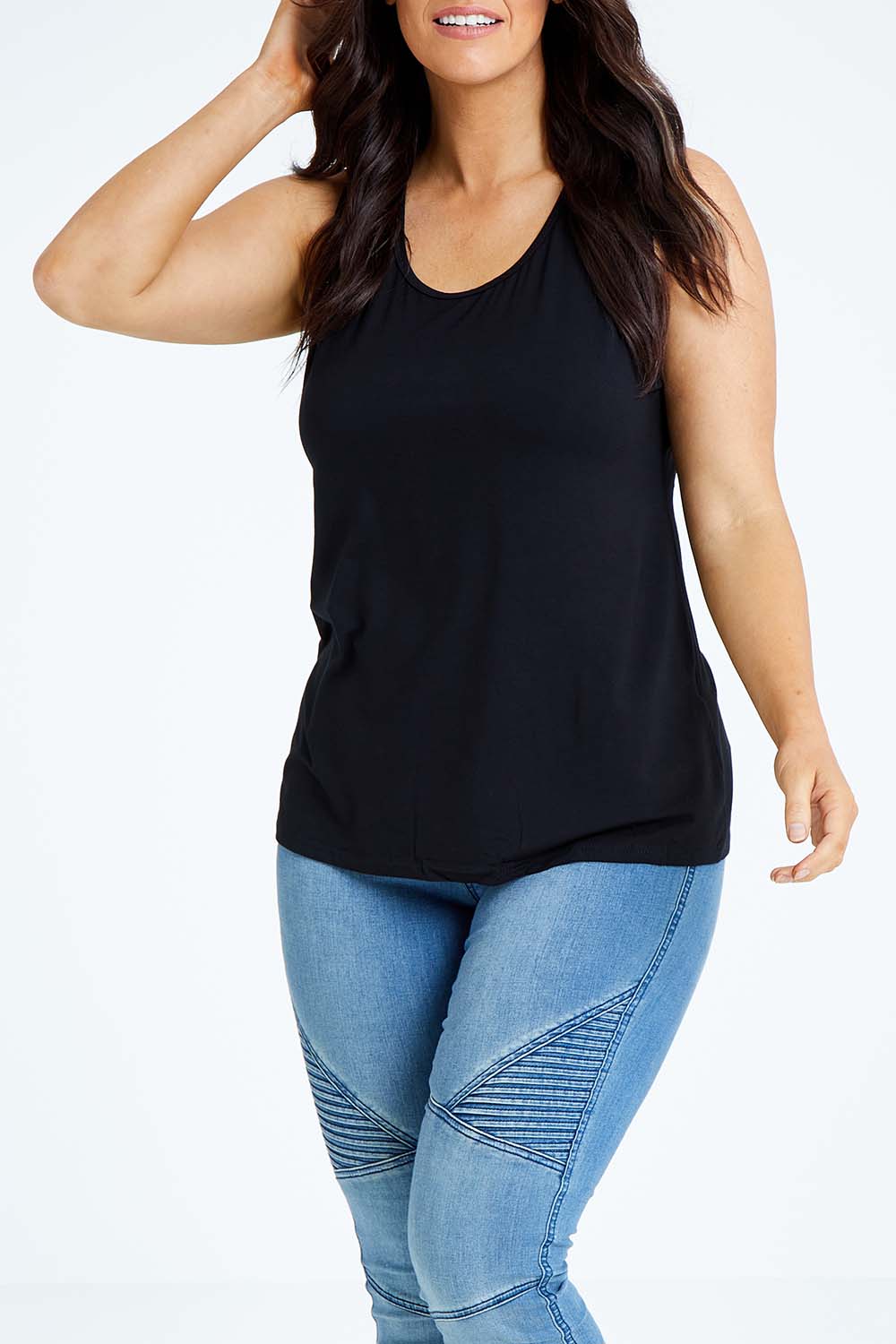 Model Laura wearing size L of the Drape Bamboo Cami in colour Black (Black), from the front, cropped image