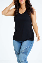 Model Laura wearing size L of the Drape Bamboo Cami in colour Black (Black), from the front, cropped image