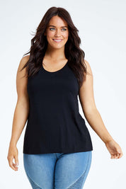 Model Laura wearing size L of the Drape Bamboo Cami in colour Black (Black), from the front, cropped image