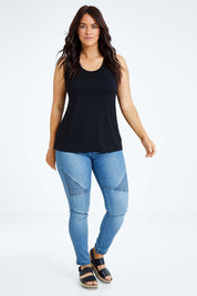 Model Laura wearing size L of the Drape Bamboo Cami in colour Black (Black), from the front, showing the whole outfit