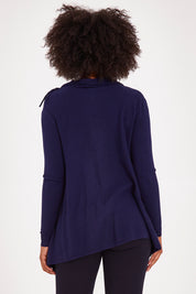 Model Olivia wearing size S of the Long Sleeve Knit Poncho in colour Navy (Blue), from the back
