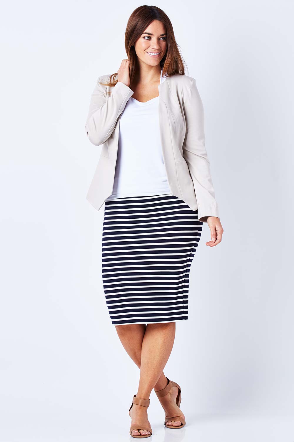 Model Laura wearing the Persuit Jacket in colour Cream, from the front, showing the whole outfit