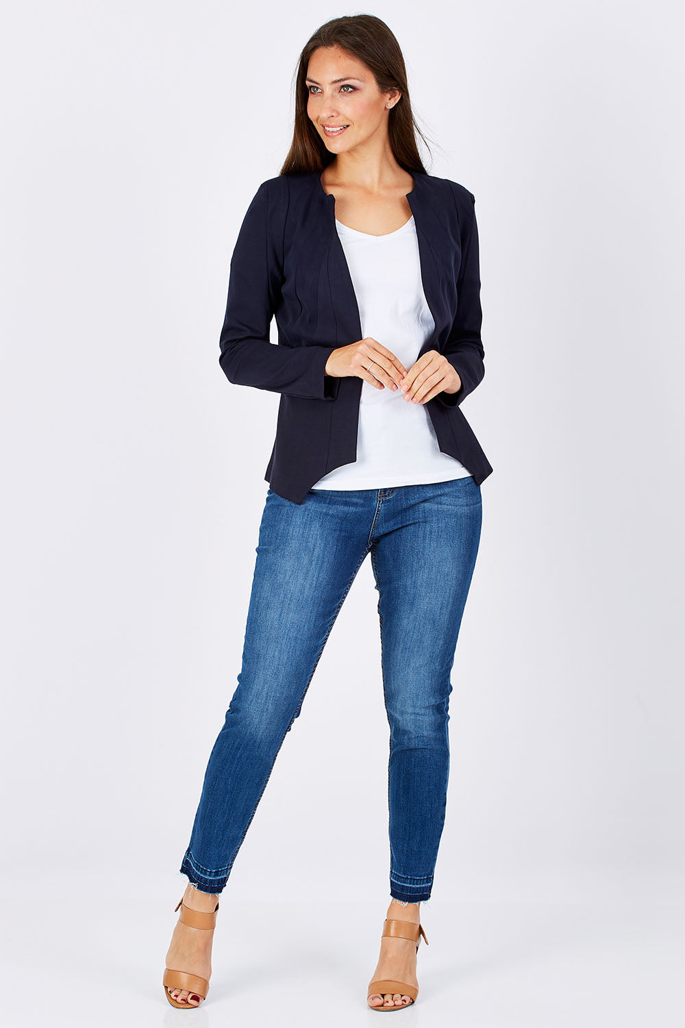 Model Anna wearing the Persuit Jacket in colour Navy (Blue), from the front, showing the whole outfit