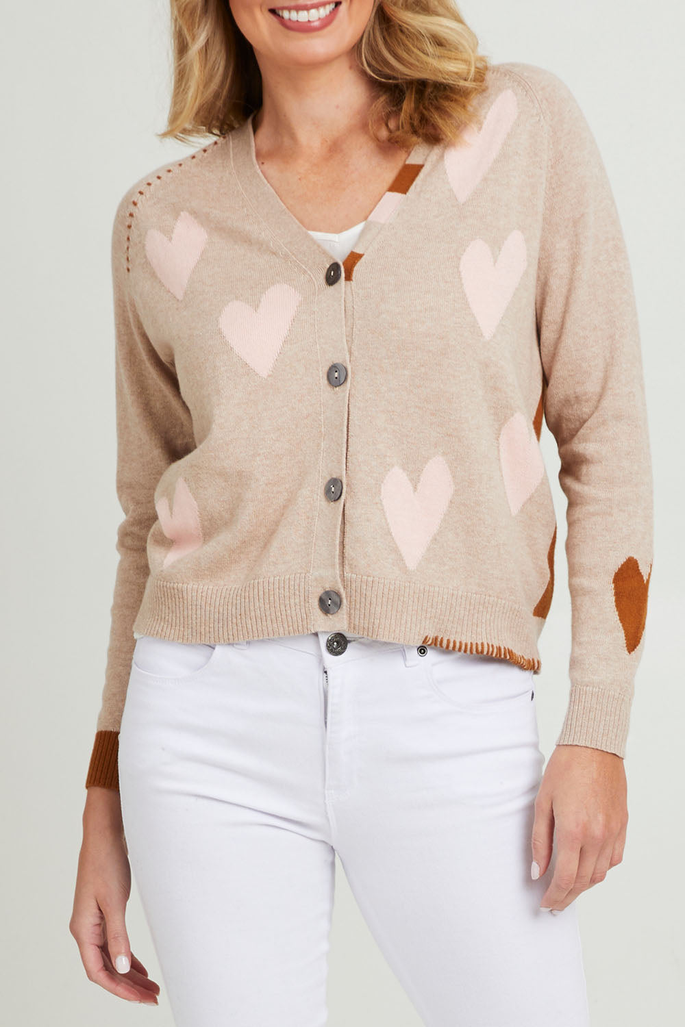 Model Grace wearing size S of the Hearts For You Cardi in colour Birch, from the front, cropped image