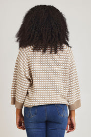 Model Ziara wearing size S of the Texture Cotton Merino Jumper in colour Camel, from the back