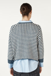 A model wearing the Texture Cotton Merino Jumper in colour Denim (Blue), from the back