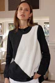 A model wearing the Diamond Dapper Cotton Cashmere Vest in colour Charcoal, from the front, showing the whole outfit