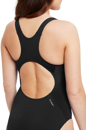 A model wearing the Cottesloe Powerback One Piece in colour Black (Black), from the back