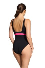 A model wearing the Square Back One Piece in colour Safari (Black), from the back