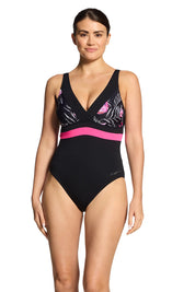 A model wearing the Square Back One Piece in colour Safari (Black), from the front, cropped image