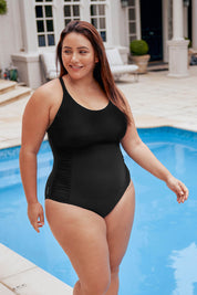 A model wearing the Multiway 1 Piece in colour Black (Black), from the front, showing the whole outfit
