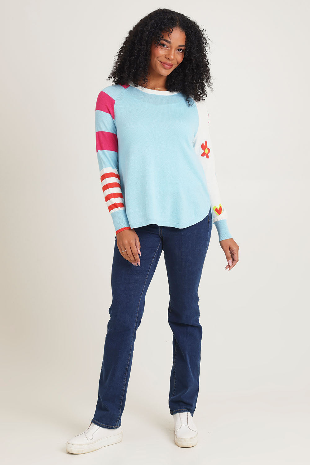 Model Ziara wearing size S of the My Happy Cotton Cashmere Jumper in colour Aqua (Blue), from the front, showing the whole outfit