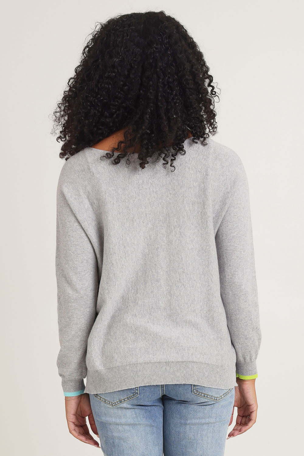 Model Ziara wearing size S of the Intarsia Hearts Cotton Cashmere Jumper in colour Marl (Grey), from the back
